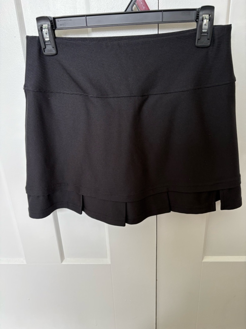Bolle Black Pleated Hem Mini Skirt with shorts underneath